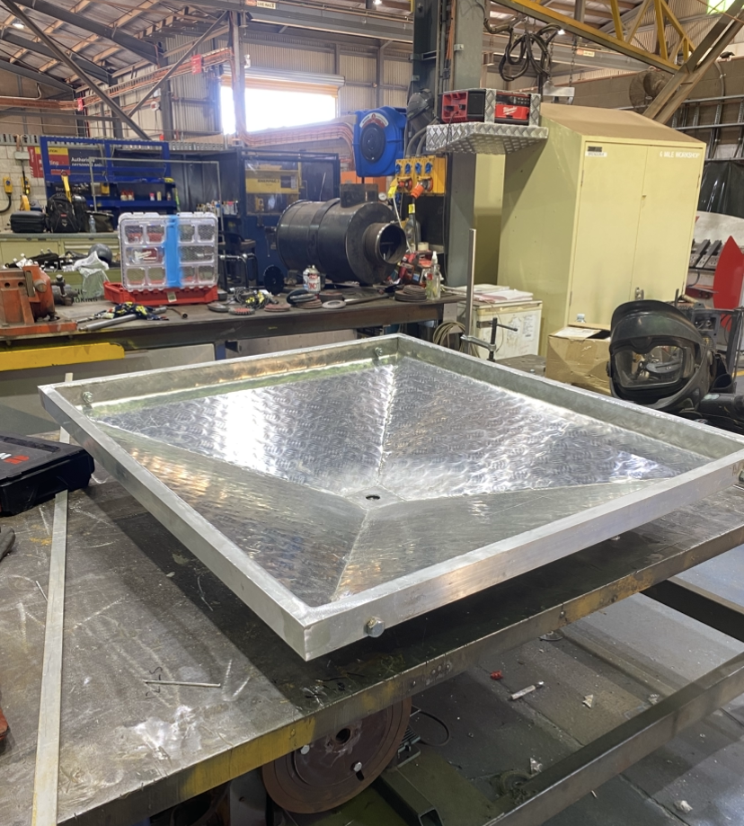 Large aluminium checker plate drainage catchment tray fabricated in the Cerberus workshop