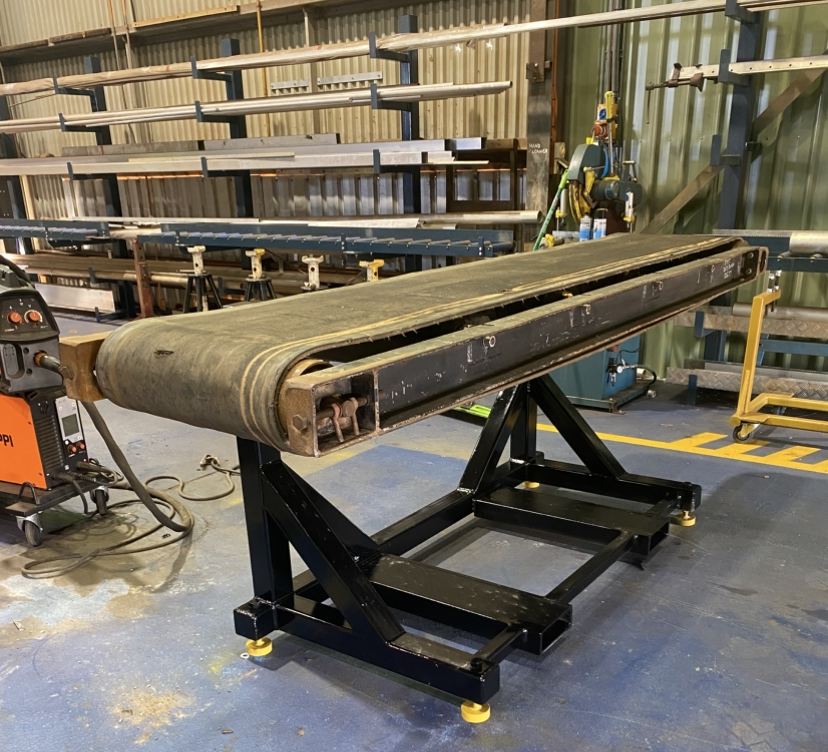 Heavy duty conveyor stand with rubber belt on adjustable steel frame