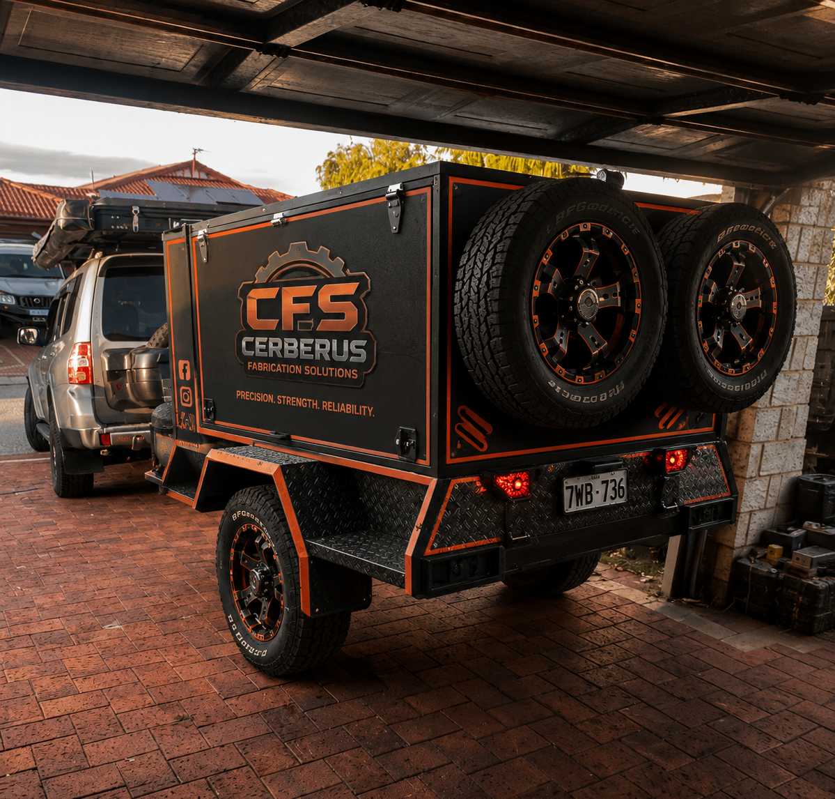 Finished CFS Cerberus branded off-road trailer with safety orange accents and dual spare wheels