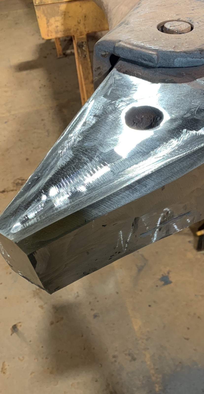 Machined and dressed wear part after weld repair and finishing