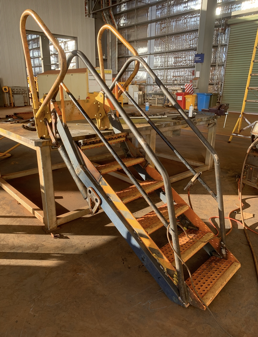 Refurbished heavy duty access stairs with new handrails and safety orange finish