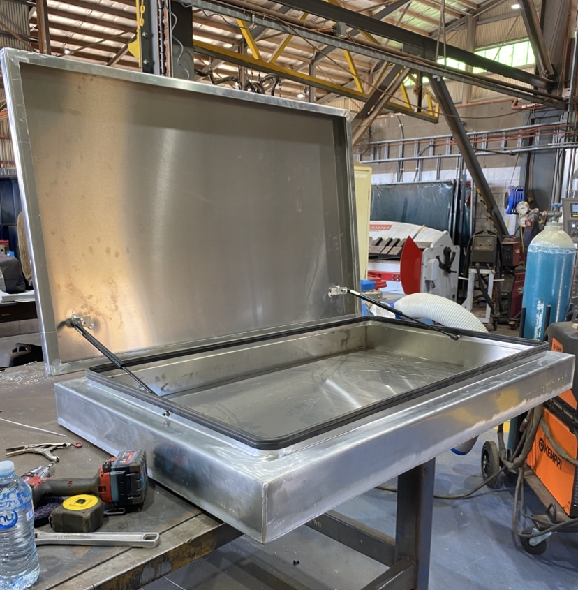 Custom aluminium enclosure with hinged lid, gas struts and sealed housing